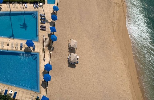 Club Deportivo Condo | Condo Velero y Galeon offers a outdoor pool and a private beach!