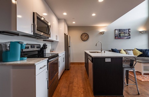Historic Downtown La Crosse Condo | Condo with balcony views of Oktoberfest! 2 minute walk to fest grounds!