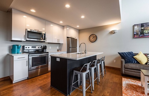 Historic Downtown La Crosse Condo | Condo with balcony views of Oktoberfest! 2 minute walk to fest grounds!