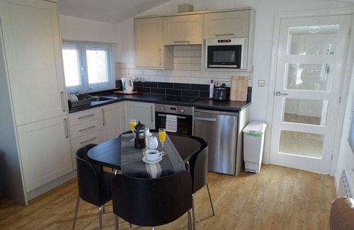 Heacham Cabin | Contemporary Beach Lodge With Sand Dunes And River Views