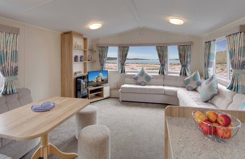 Kilwinning House | Contemporary caravan with one double with TV, and two twin.