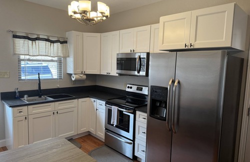 Caryville House | CONVENIENCE! Steps away to a private dock & 5 miles to a marina/grocery/hwy!