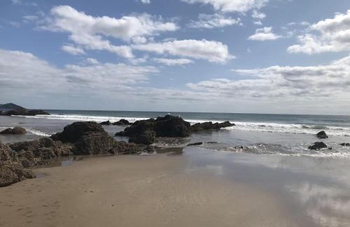 Widegates House | Corn Barn at East Trenean Farm -Luxury Cornish Barn Conversion sleeping 8 with hot tub, private garden, rural views and EV facilities