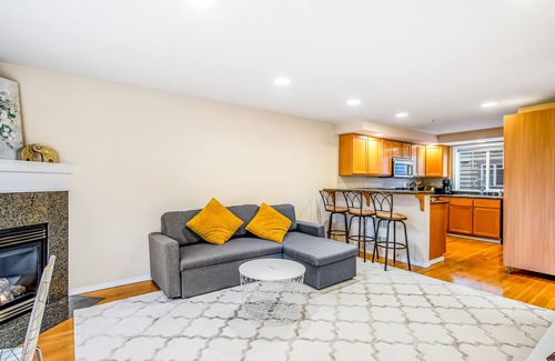 Loyal Heights House | Corner Townhome with Deck, Tons of Natural Light, WiFi, & Gas Fireplace