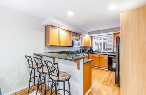 Loyal Heights House | Corner Townhome with Deck, Tons of Natural Light, WiFi, & Gas Fireplace