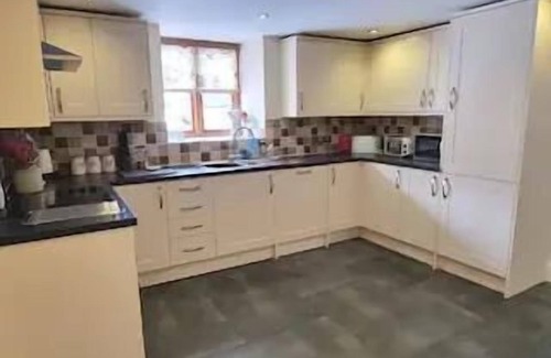 Corwen House | Cosy Barn - Sleeps 8, Hot Tub & Countryside Views