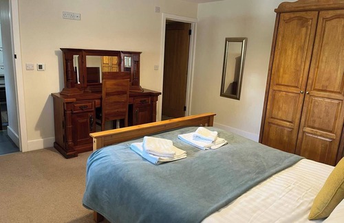 Corwen House | Cosy Barn - Sleeps 8, Hot Tub & Countryside Views