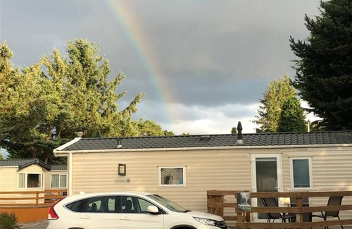 Boat of Garten House | Cosy chalet - Poppy Lodge in Boat of Garten, Dog Friendly, free wifi!