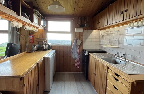 Aberdovey Ski Chalet | Cosy Swiss-Style Wooden Chalet in Aberdovey, Snowdonia with stunning sea views