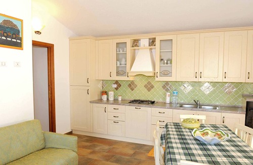 Baia Sant'Anna Apartment | Cottage with beautiful garden, in quiet area