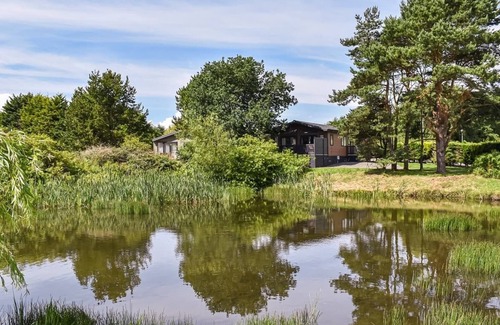 Kirkcudbright Ski Chalet | Country and modern cladded lodge with sea views.