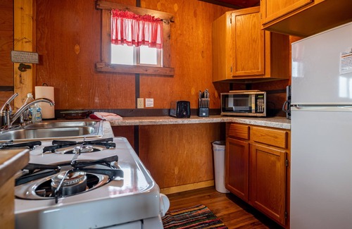 Cody Apartment | Cowboy Bunkhouse #2, clean rustic charm, located in South Fork Valley, 10 minutes from Downtown Cody