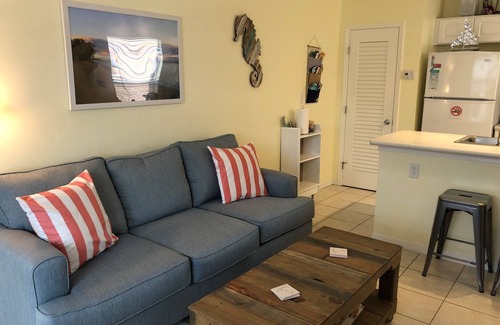 Navarre Beach House | Cozy 1 Bedroom Townhome with a pool and just steps from the beach.