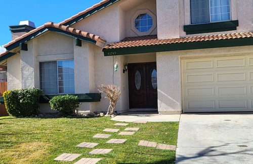 Lancaster House | Cozy 4-bedroom house has WiFi and AC in superb Lancaster, a game room & hot tub.