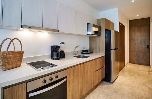 Tohoku Apartment | Cozy Apartment in Playa del Carmen | Game Room, Gym & Rooftop Pool | Great Amenities