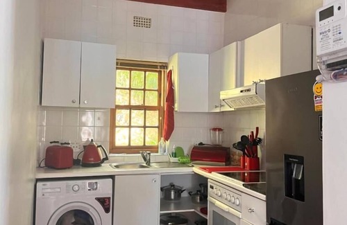 Camps Bay Ski Chalet | Cozy Camps Bay House with mountain and sea view