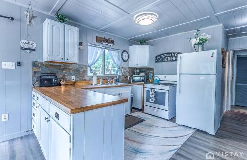 Duck Creek Village House | Cozy Cottage with Stunning Deck Views