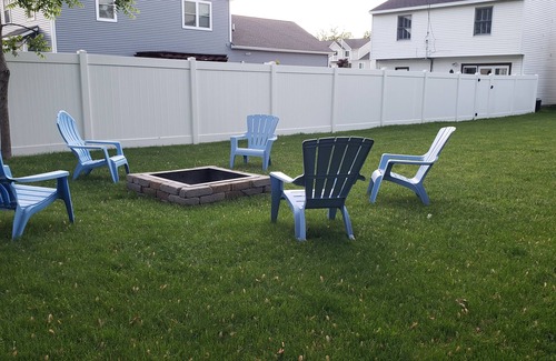 Grand Haven House | Cozy efficiency upper, a short walk downtown. Pet friendly with large backyard!