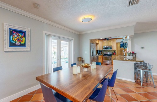 Nautilus Isle House | Cozy Home with pool, dock, canal view, fully equipped kitchen, dog friendly