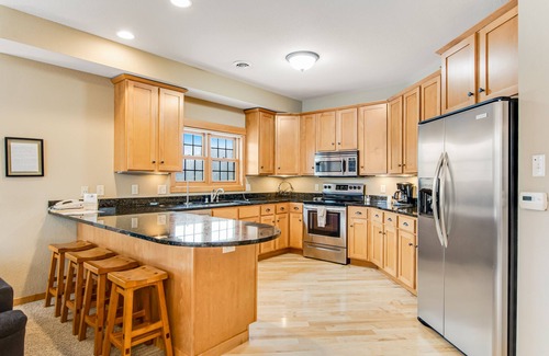 Three Lakes Condo | Cozy lakefront condo with balcony, fireplace, AC, indoor pool, gym, & hot tubs