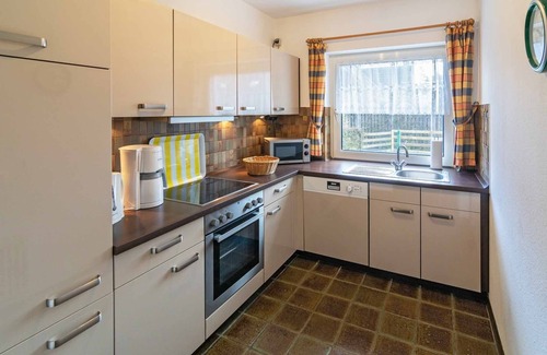 Harlesiel House | Cozy semi-detached house with fireplace and beautiful garden to relax.