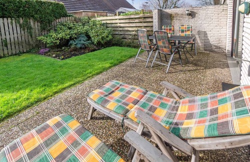 Harlesiel House | Cozy semi-detached house with fireplace and beautiful garden to relax.