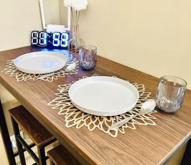 Binan City Apartment | Cozy Studio near Nuvali, Enchanted Kingdom - Private Cinema with Netflix & Disney Plus with Free Pool Access