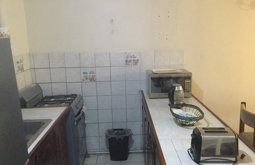 Molynes Gardens House | Cozy town house with two bedrooms that sleeps a maximum of four persons.