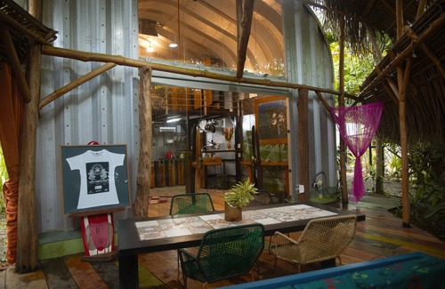 Jaco House | Cozy tropical/industrial quonset located in a secondary tropical forest.