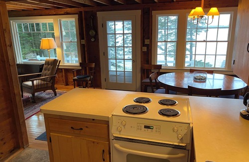 Central Coast House | Cozy waterfront cottage overlooking Muscongus Bay with stunning sunset views.