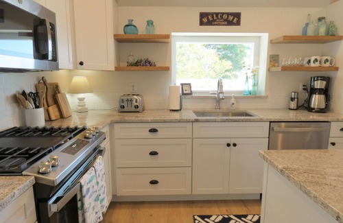 Trenton Cottage | Cozy waterfront getaway for two with views of the ocean and mountains in Acadia!