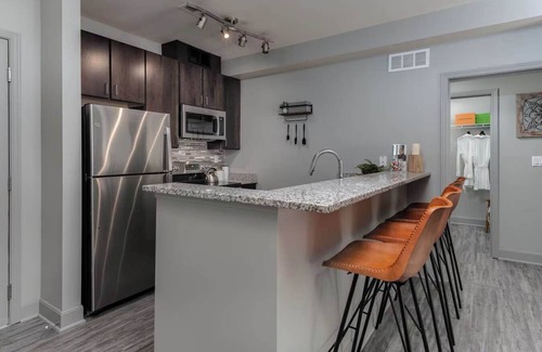 Central Business District Apartment | CozySuites at the Banks gym, pool 12
