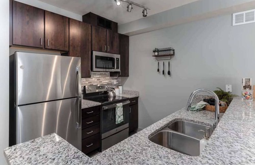 Central Business District Apartment | CozySuites at the Banks gym, pool 12