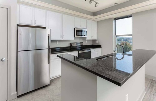 Central Business District Apartment | CozySuites at the Banks gym, pool 10