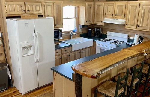 Ellijay Cabin | Creekfront Cabin with Waterfall. Hot Tub, Fire Pit, Gameroom, and more.