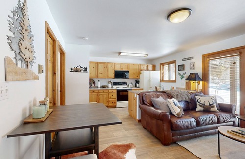 Grand Lake Condo | Creekside condo w/patio, fireplace & open layout perfect for a group getaway