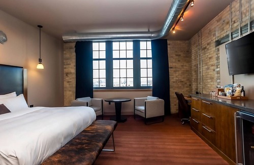 Fifth Ward Hotel | Custom Deluxe King at The Iron Horse Hotel, Short Drive To Erie Street Plaza!