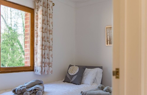 Doddington House | Delightful lodge located in the middle of Sharsted Wood near Canterbury with a pool!