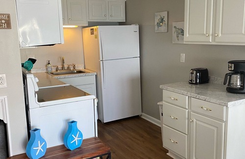 Sneads Ferry Villa | Deluxe 1 BR Ocean Front , King Bed, ELEVATOR, Pool, LINENS & Screened Porch