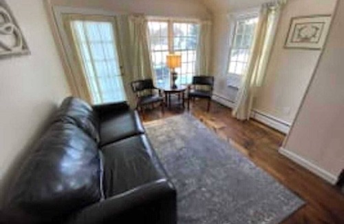 West Dover Resort | Deluxe King Suite, Living Room area w/sofa bed & fireplace, private entrance