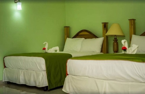 Runaway Bay Resort | Deluxe Quadruple Room, 2 Queen Beds, Garden View