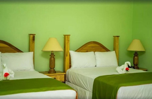 Runaway Bay Resort | Deluxe Quadruple Room, 2 Queen Beds, Garden View