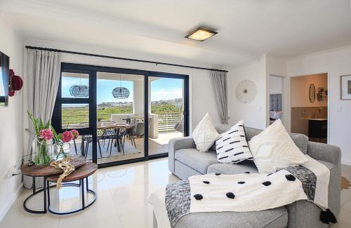 Big Bay Apartment | Designer Beachfront Apartment in Big Bay with swimming pool- 2 bedroom, 1 Azure