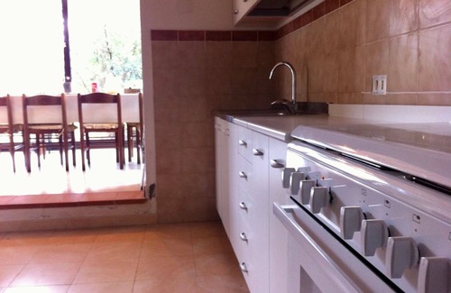 Poveromo Apartment | Detached bungalow-style house at 25m from the beach with 2.000m2 of privat garden around it. Air con