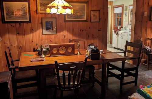 Putnam Station Cottage | Direct lakefront cottage with wood burning fireplace in great room. Pet friendly