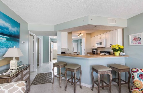Seawinds Condo Condo | Direct oceanfront corner condo with large balcony, beachfront pool, and garage parking