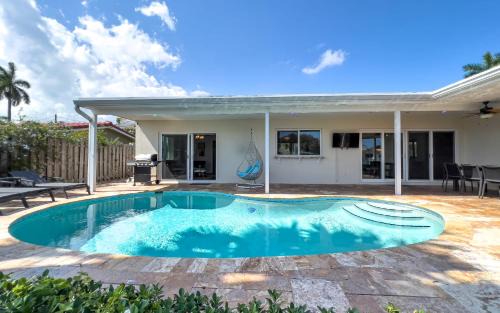 Coral Ridge Isles House | Dockside Daydreams - Canalfront and Pool Oasis