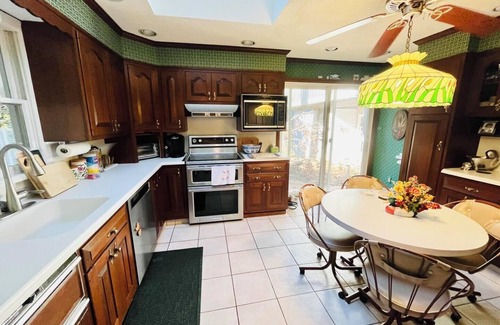 The Pines House | Dog-Friendly Beach Getaway with Koi Pond, Patio & Walkable to Town!