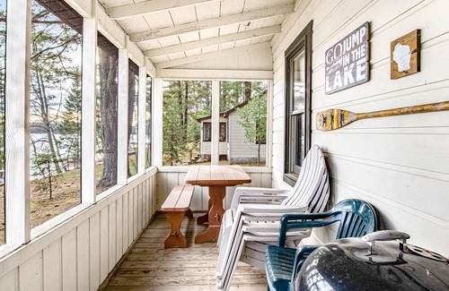 Presque Isle Cabin | Dog-friendly cabin with waterfront views, lake access, sandy beach, & rec room