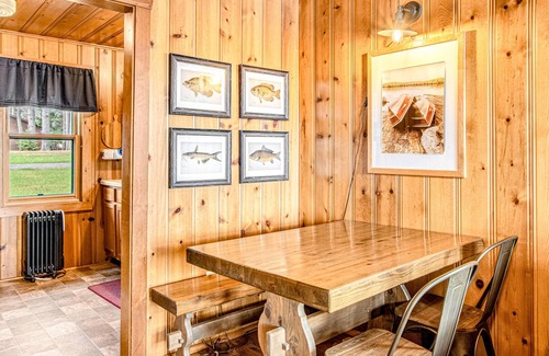 Presque Isle Cabin | Dog-friendly cabin with waterfront views, lake access, sandy beach, & rec room